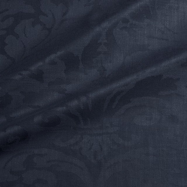 Deep midnight blue woven damask with tonal scrolling leaves and fine crosshatch texture