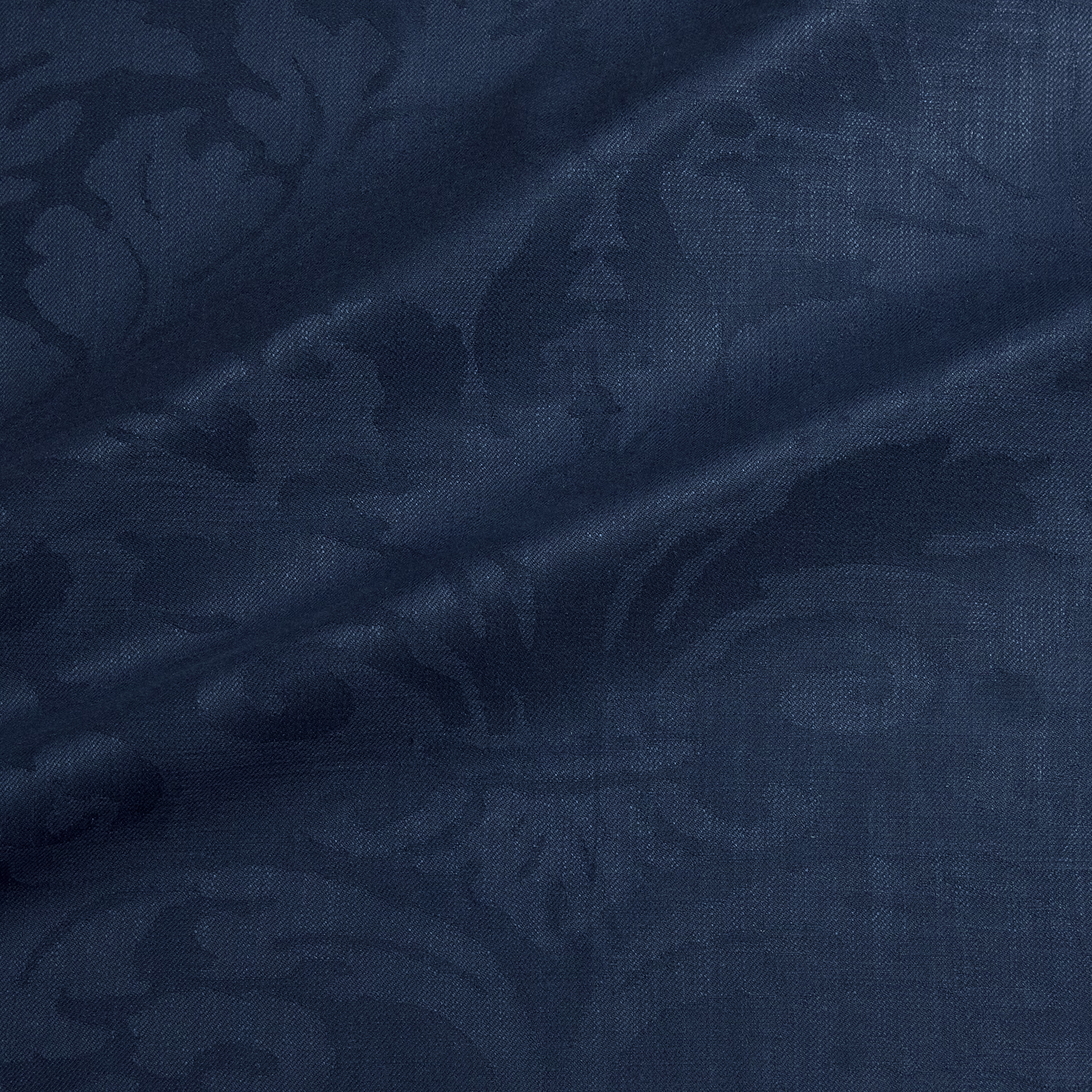 Dark ocean-blue damask with shadowed floral forms and fine woven texture