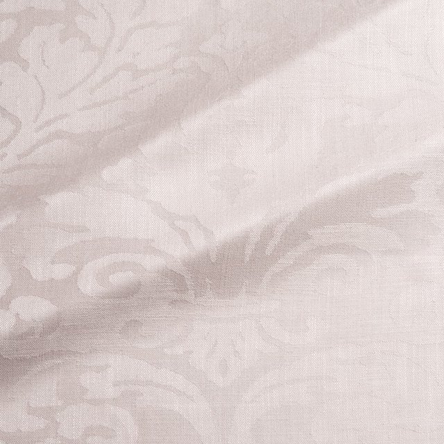 Pale pink taupe damask with scrolling floral motifs and a fine woven texture