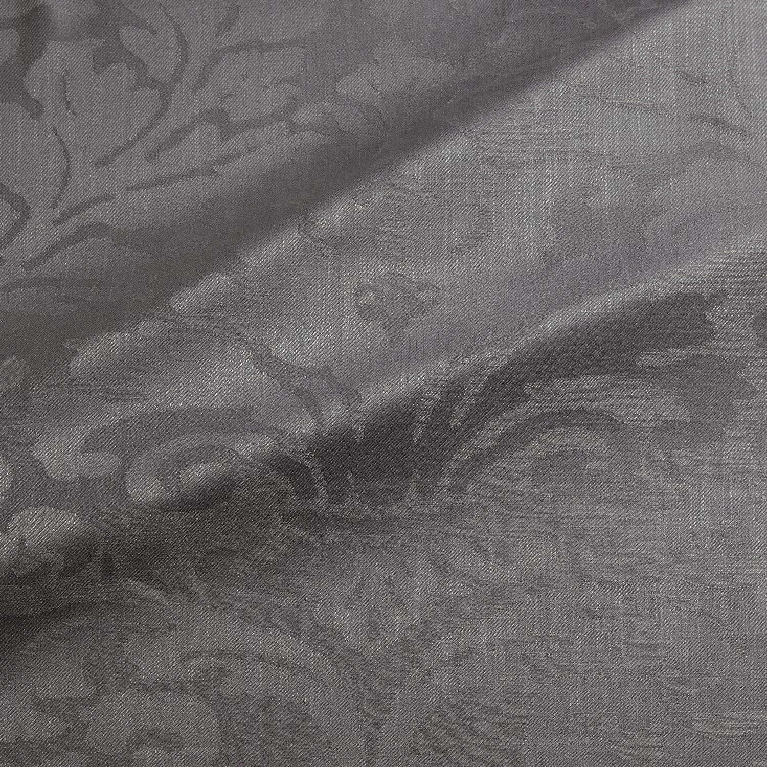 Muted pebble-grey damask fabric with charcoal scrolling motifs and fine woven texture