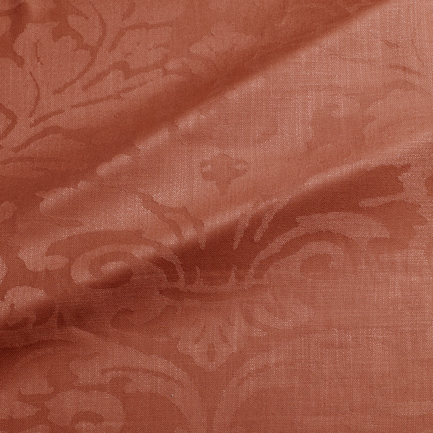 Muted terracotta damask fabric with burgundy tonal motifs and fine woven texture