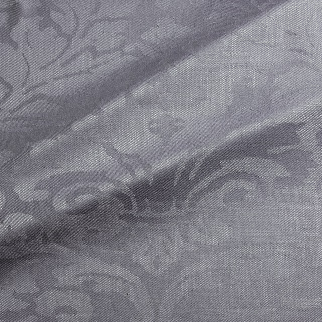 Cool pigeon-grey woven damask with darker scrolling motifs and soft tonal sheen