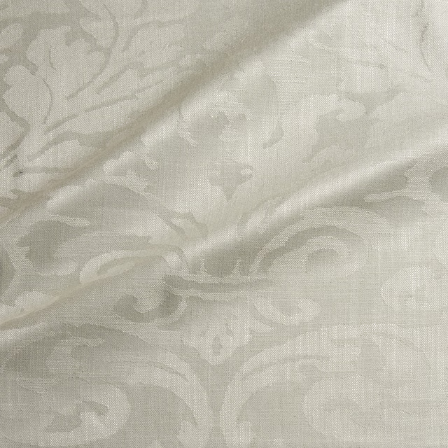 Pale greige-cream woven damask with scrolling leaves and subtle sheen