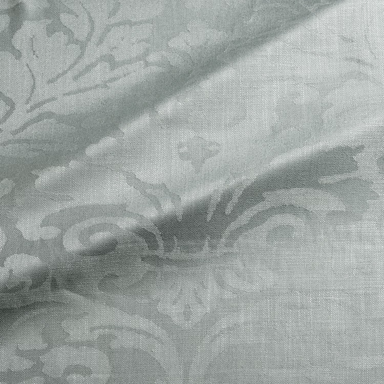 Pale sea-mist blue-grey woven damask with scrolling floral motifs and fine texture