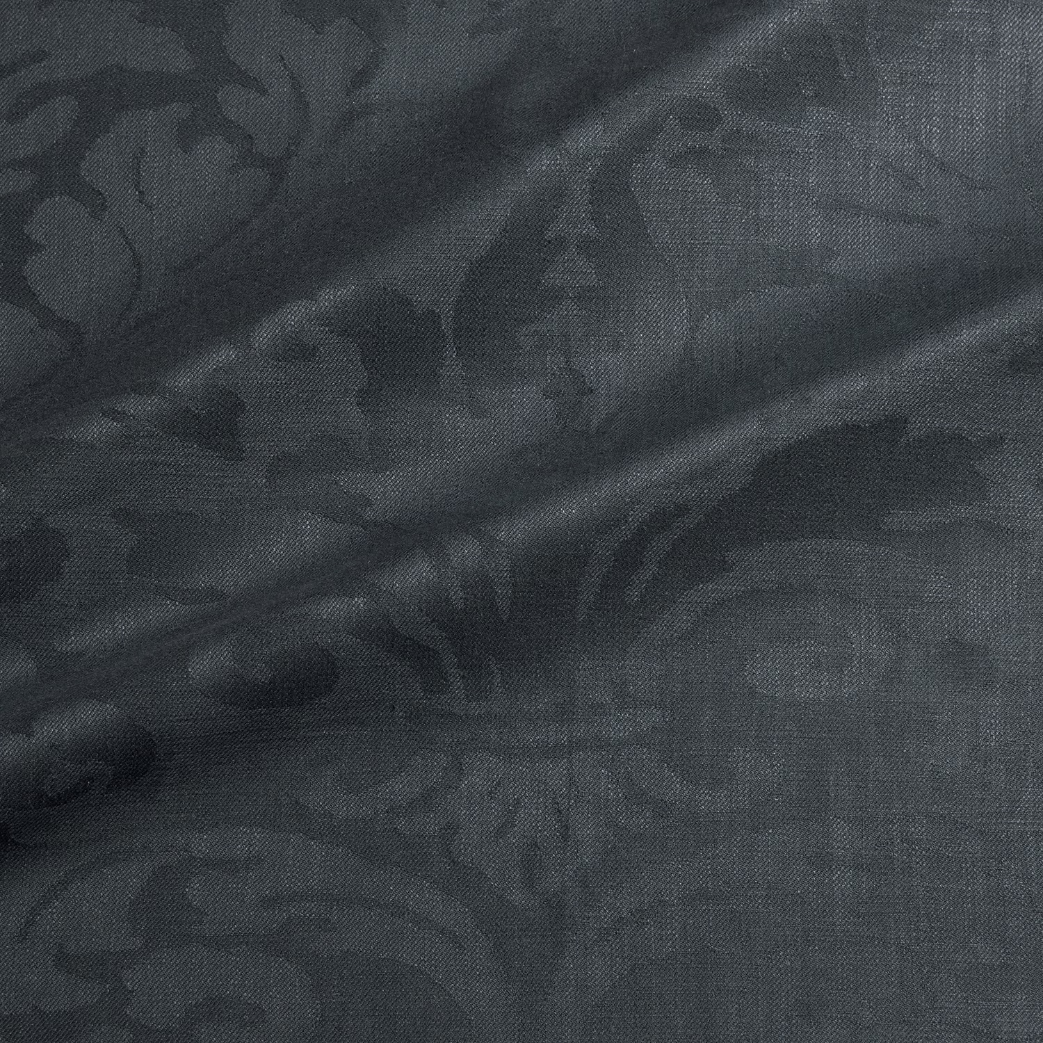 Deep storm-grey woven damask with shadowed scrolling floral motifs and subtle sheen