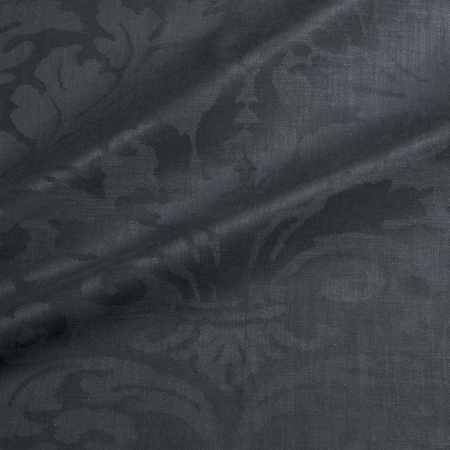 Deep storm-grey woven damask with shadowed scrolling floral motifs and subtle sheen