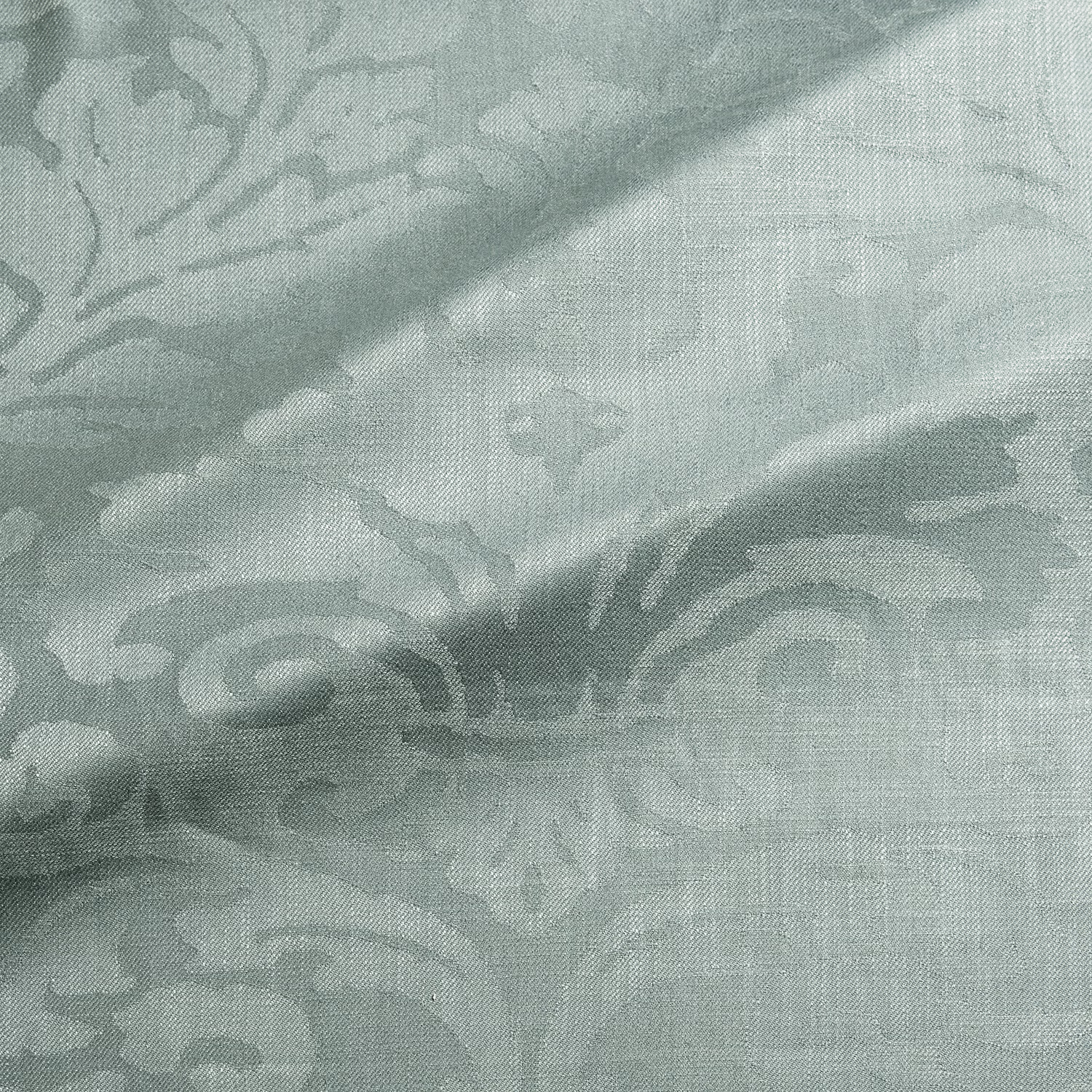 Pale aqua-teal damask weave with sweeping scrolls and a softly crosshatched surface