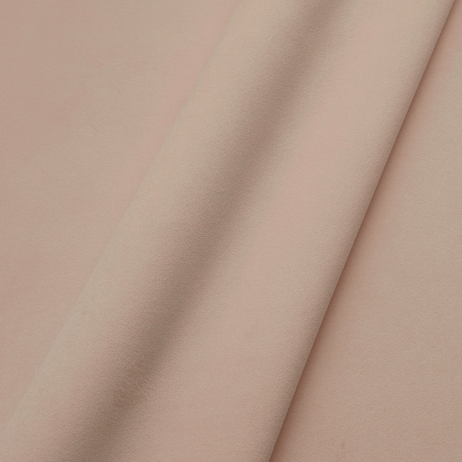 Dusty blush pink velvet folded to show its soft directional nap