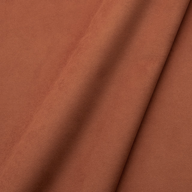 Warm brick terracotta velvet with smooth pile and darker folded nap