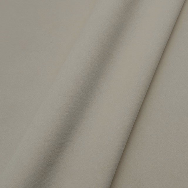 Warm grey-beige plain velvet showing a softly shaded directional plush nap