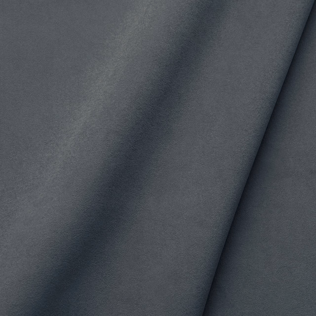 Deep charcoal-grey velvet swatch showing soft nap and subtle tonal variation in folded fabric