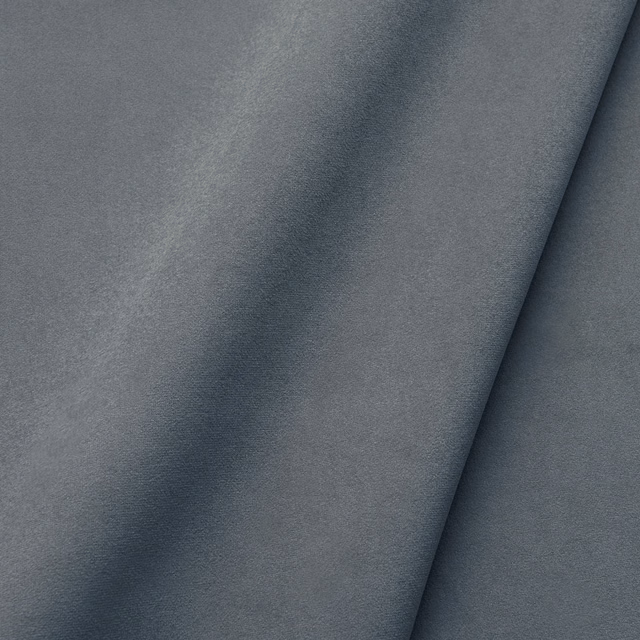 Cool charcoal-grey velvet swatch showing soft pile, subtle sheen and deep folded shadows
