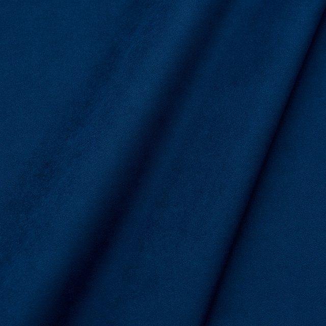 Deep navy blue velvet swatch showing a plain pile with dark folds and blue highlights