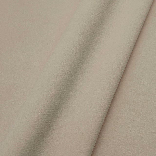 Muted pebble-taupe velvet with a soft nap folding into gentle shadows