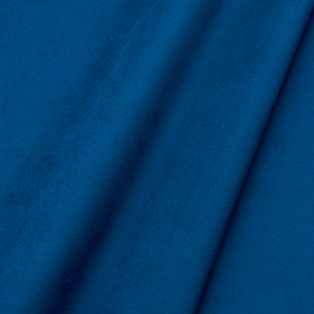 Deep sapphire-blue velvet with soft pile and diagonal draped folds