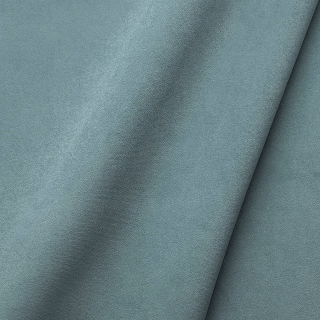Muted blue-teal velvet showing a plush directional nap and soft shifting sheen