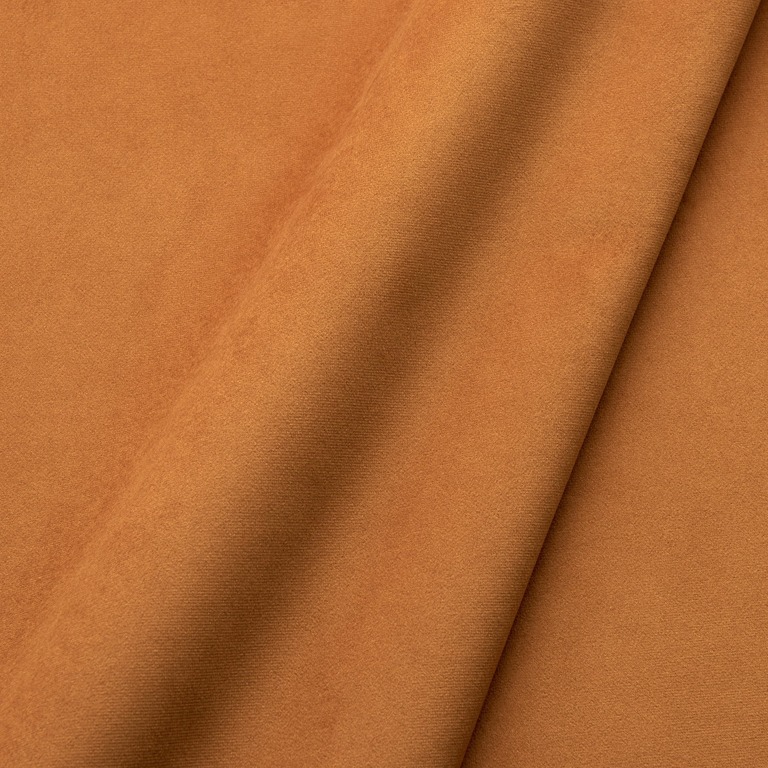 Warm turmeric-orange velvet with a close pile and darker fold shading