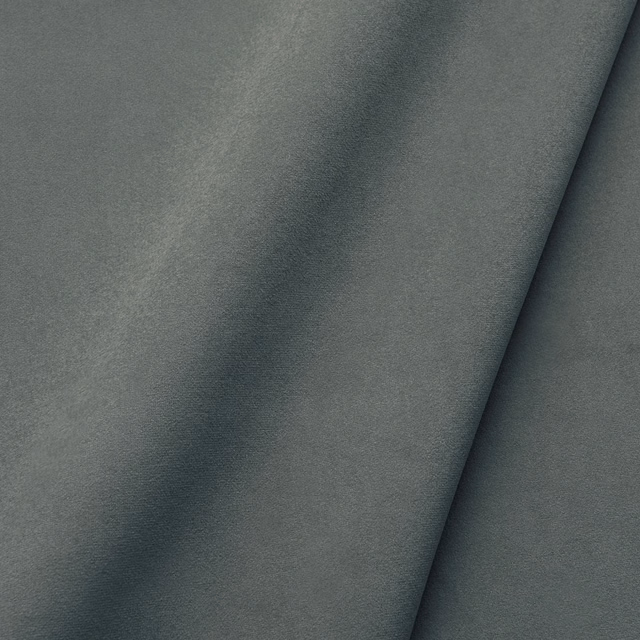 Close-up of cool zinc-grey velvet with soft directional nap and deep shading