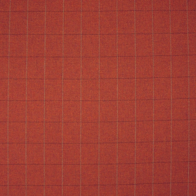 Deep rust terracotta woven fabric with a fine blue-grey windowpane check