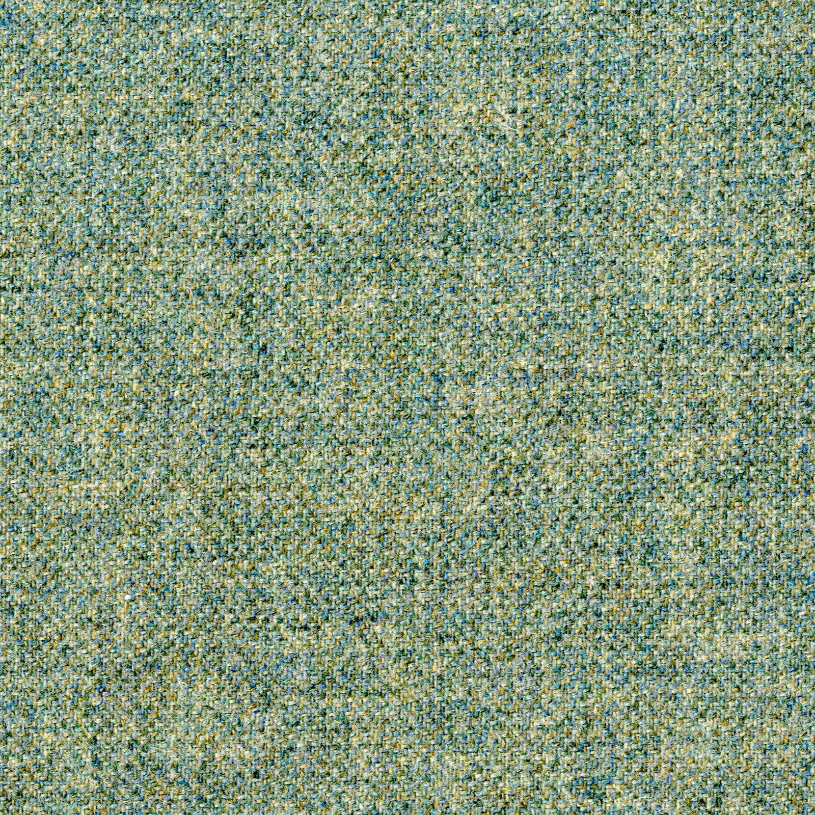 Close-up of mottled teal-green woven fabric with cream and muted yellow flecks