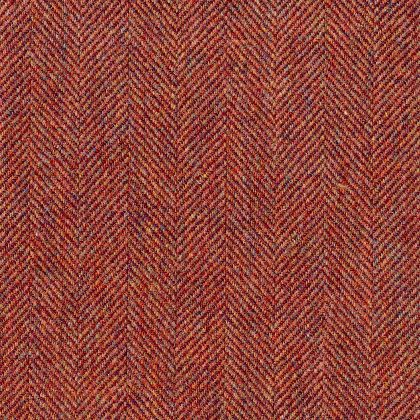 Rust-red, terracotta and brown close-up fabric with fine textured herringbone weave