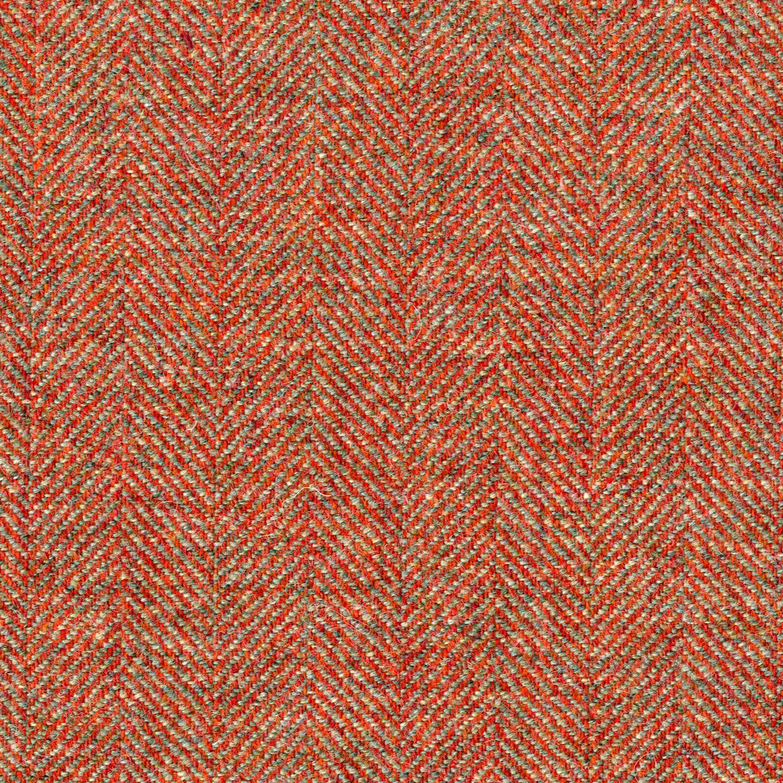 Muted coral-red and grey herringbone weave with a softly textured surface
