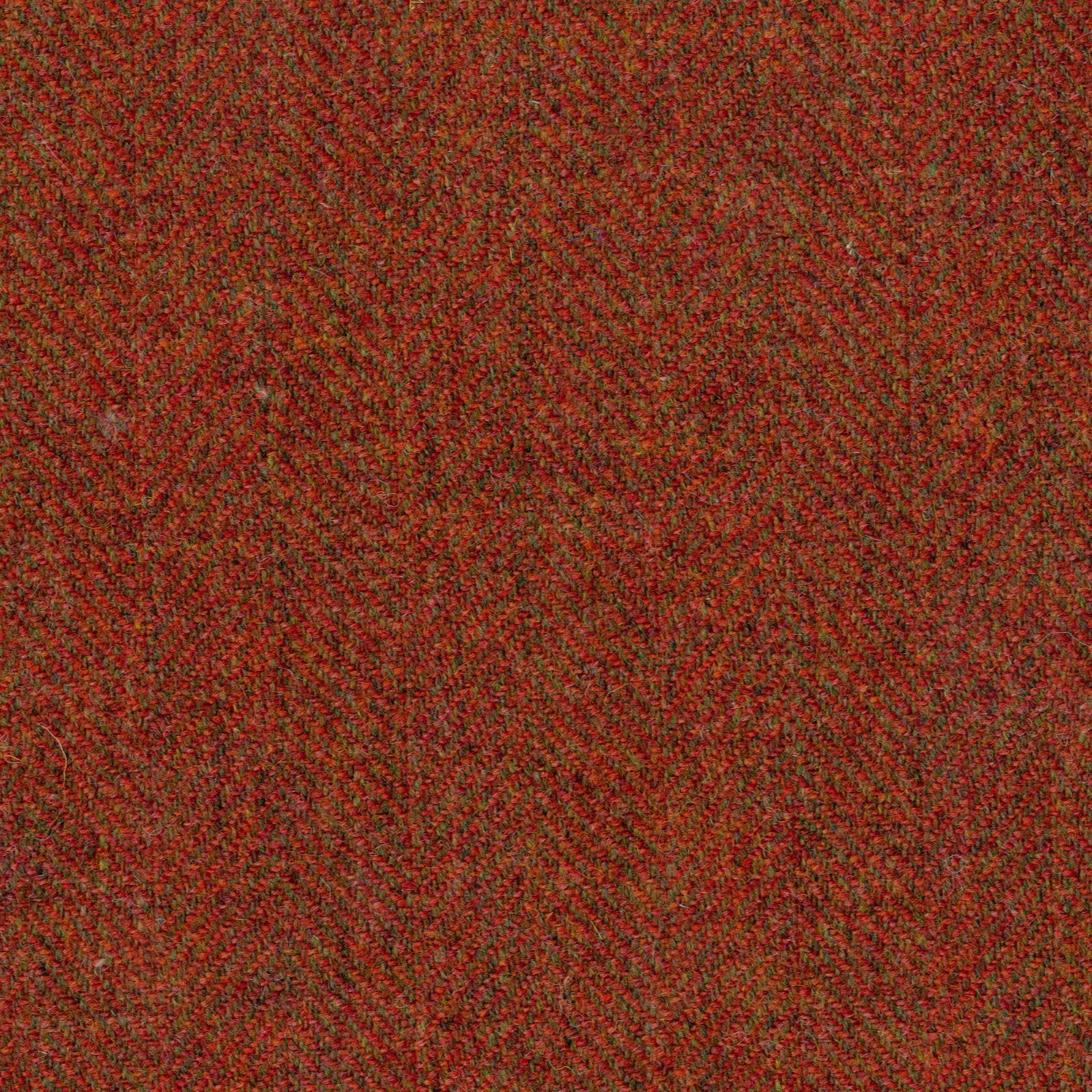 Deep russet red herringbone weave with olive-brown flecks and fine texture