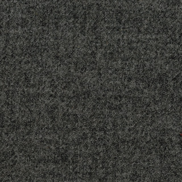 Dark charcoal-grey woven textile with fine mottled flecks and shadowed texture