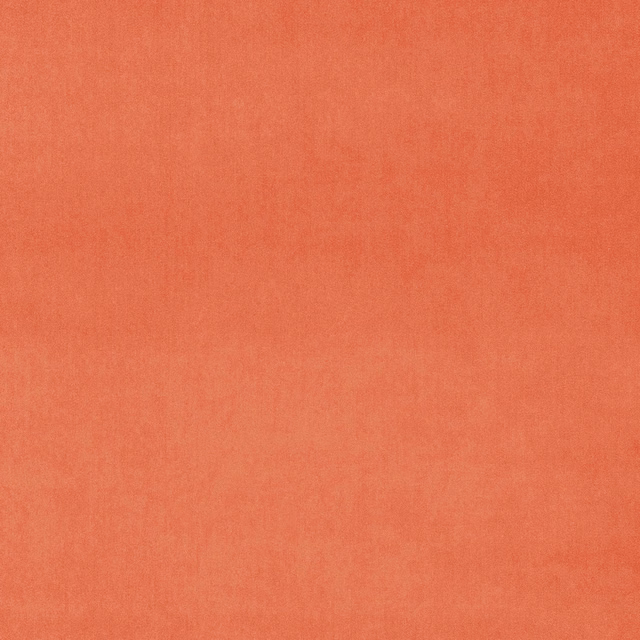 Coral plain velvet fabric with a soft, light-catching pile