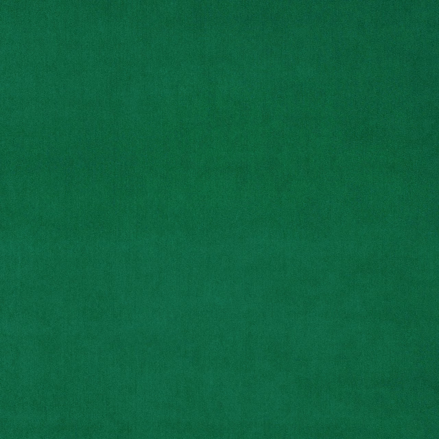 Solid emerald green velvet fabric with a smooth, low-sheen pile