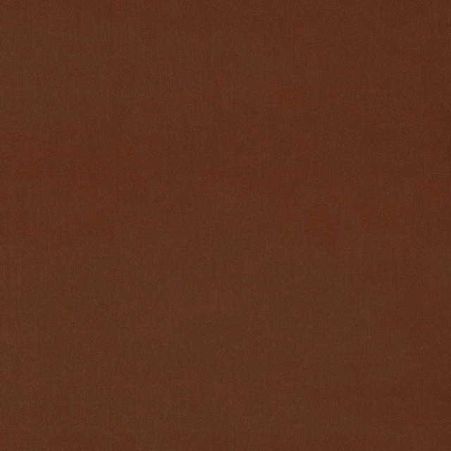 Close-up of warm tawny brown velvet with a smooth plain pile