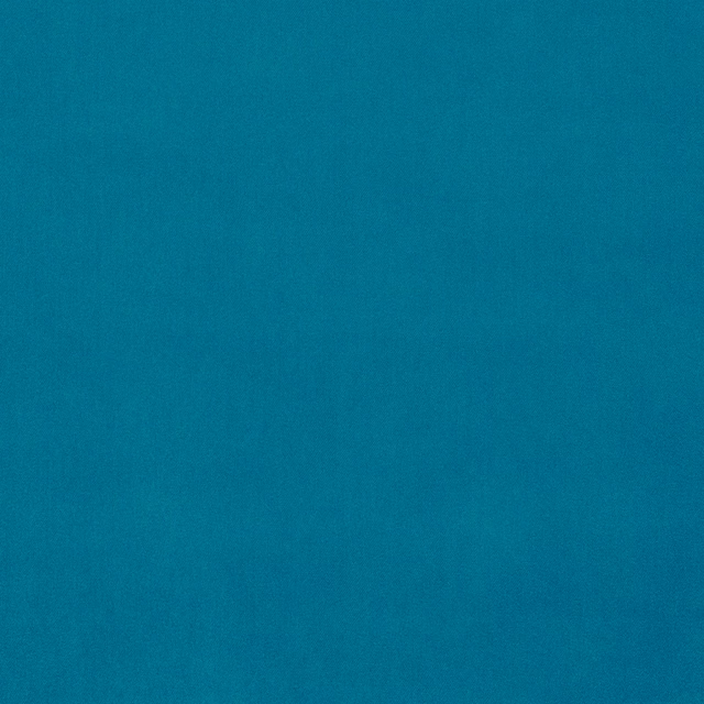 Solid vibrant teal velvet fabric with a smooth, even pile