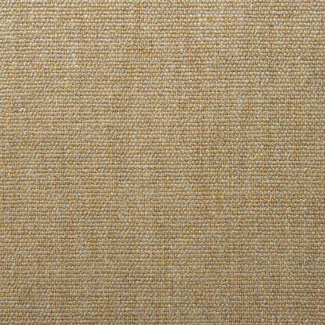Close-up of Orta Sand’s nubby sandy-gold plain weave with muted olive flecks