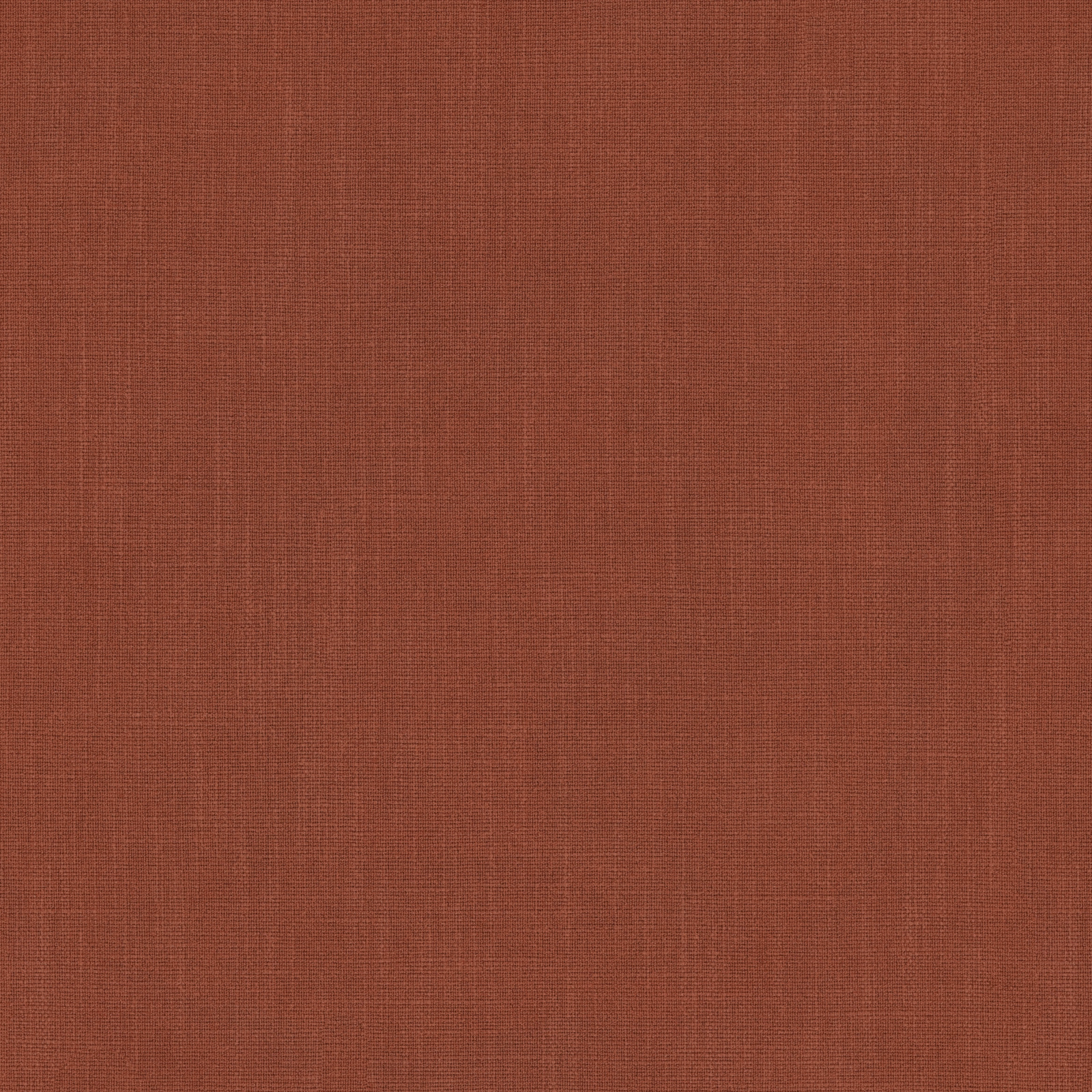 Close-up of muted terracotta plain woven fabric with fine crosshatch texture