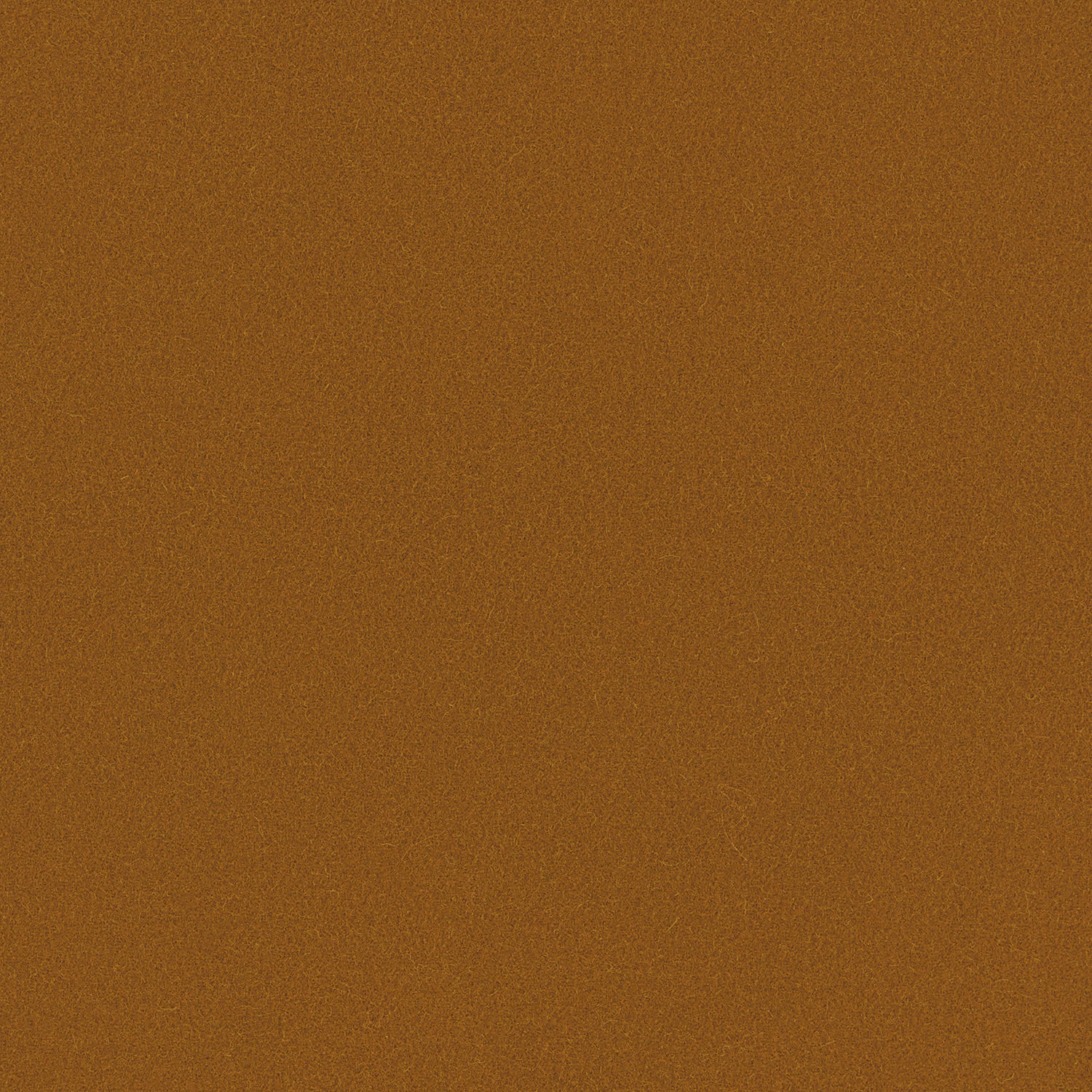 Close-up of warm honey-brown wool with a fine, subtly honeycombed woven texture