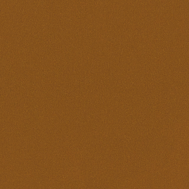 Close-up of warm honey-brown wool with a fine, subtly honeycombed woven texture