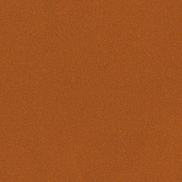 Close-up of warm sienna terracotta wool with a fine subtly mottled plain weave