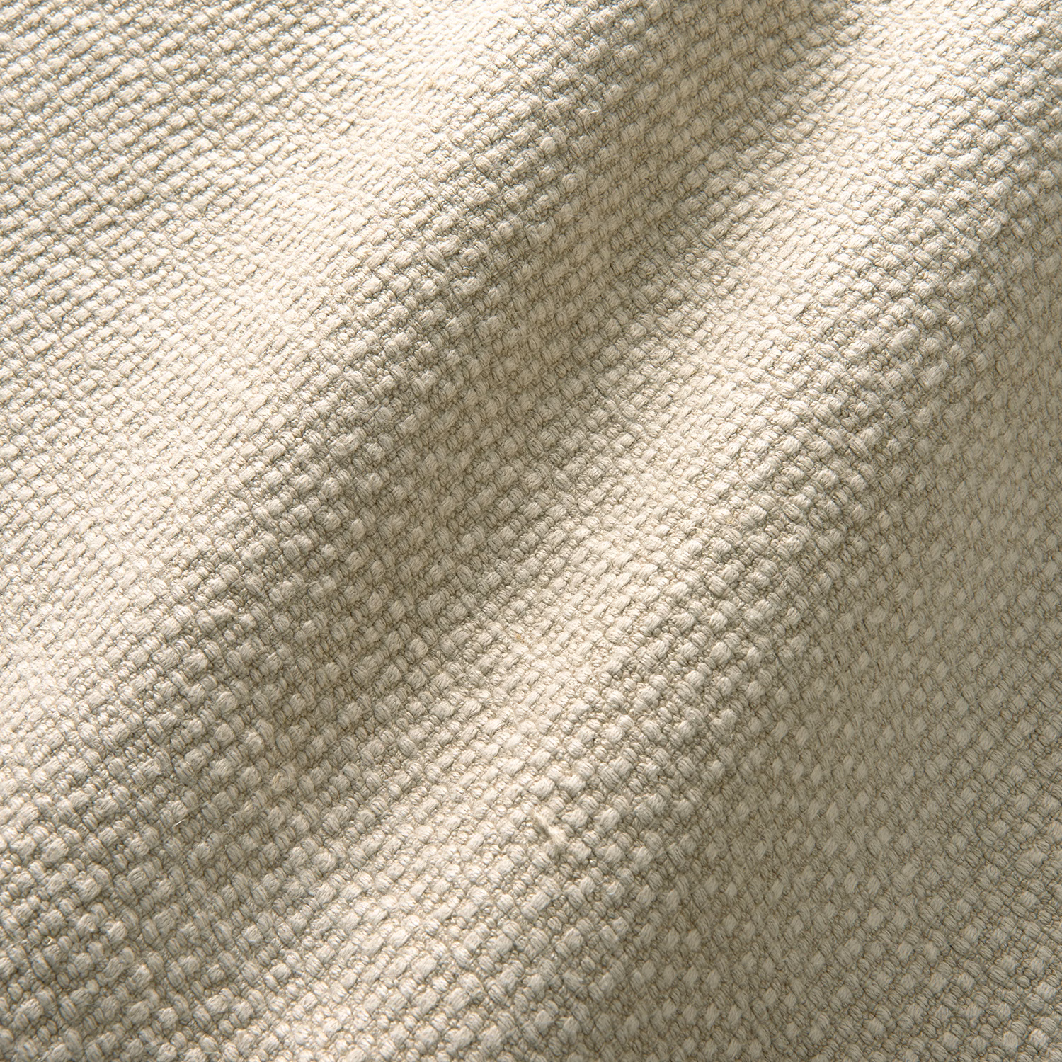 Warm dune-beige linen with a small irregular woven texture and taupe shadowing