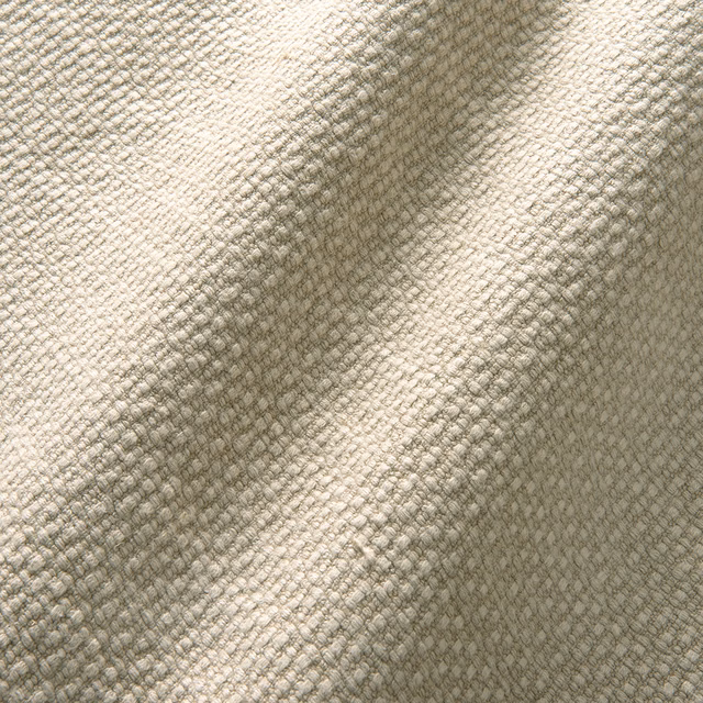 Warm dune-beige linen with a small irregular woven texture and taupe shadowing