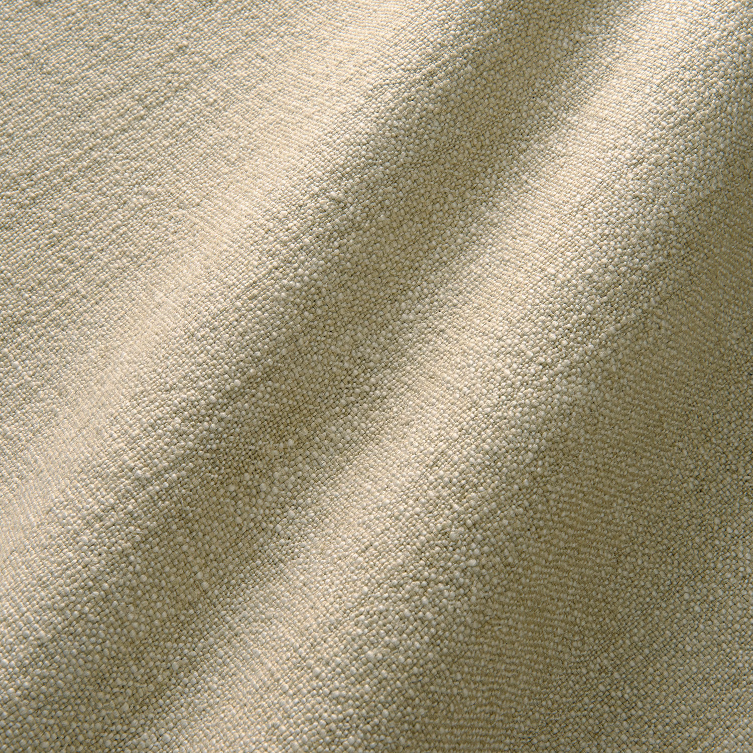 Close-up of ivory-oat plain canvas weave with olive-grey shadowed folds