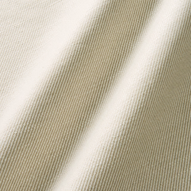 Warm ivory-greige linen-cotton weave with fine ribs and soft folded shadows