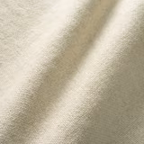 Warm ivory pumice fabric showing a fine nubby weave across softly folded cloth