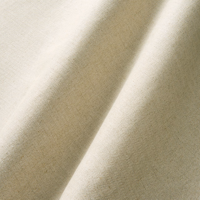 Warm sand herringbone weave with pale cream highlights across folded fabric