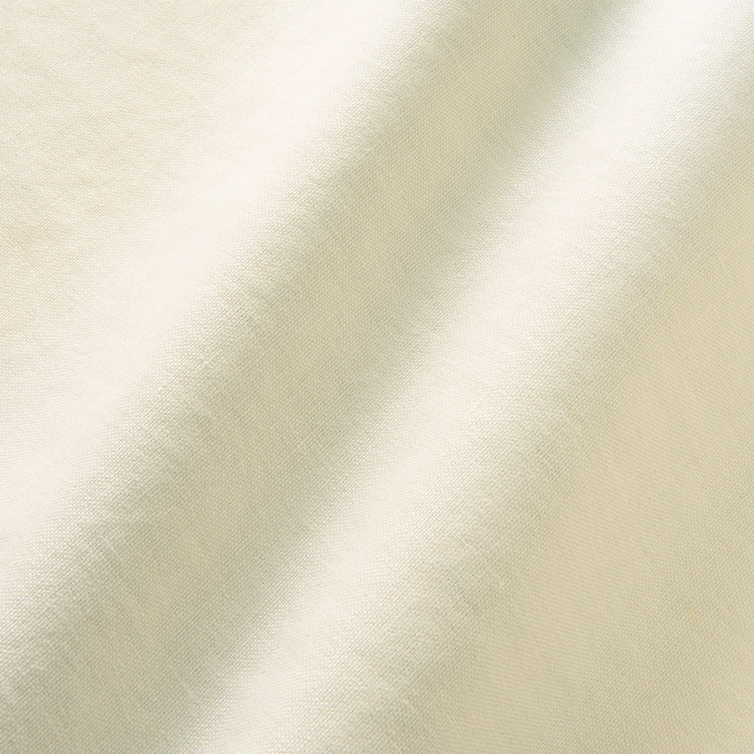 Close-up of ivory fabric with pale sage-grey cloudy bands and fine woven texture