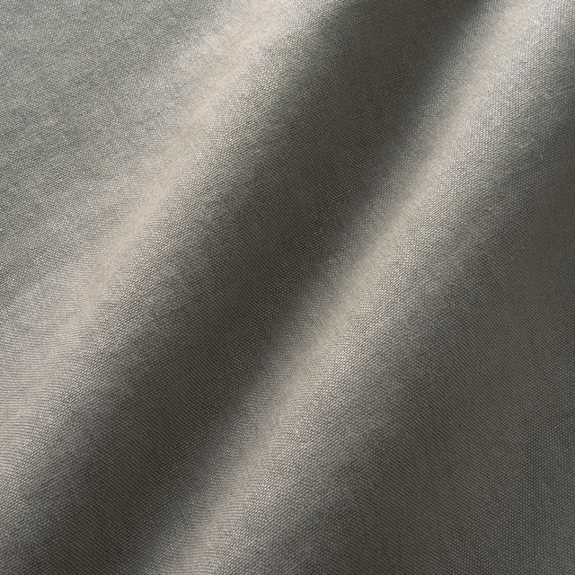 Cool charcoal-grey woven fabric with silvery highlights and subtle diagonal tonal movement