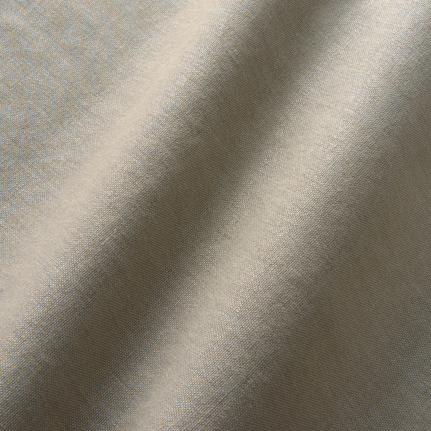 Close view of grey taupe fine weave forming soft folded tonal highlights