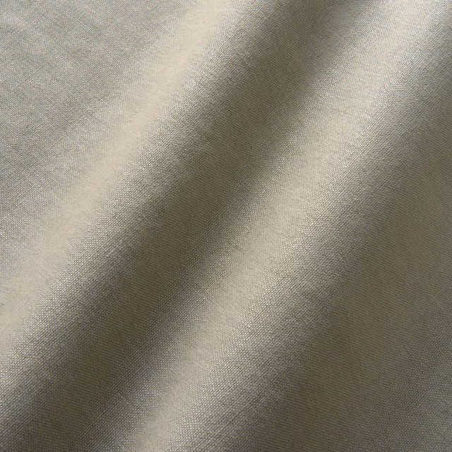 Close view of grey taupe fine weave forming soft folded tonal highlights