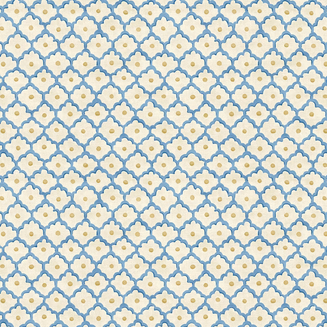 Lapis blue scalloped motifs with mustard centres on a textured ivory linen ground