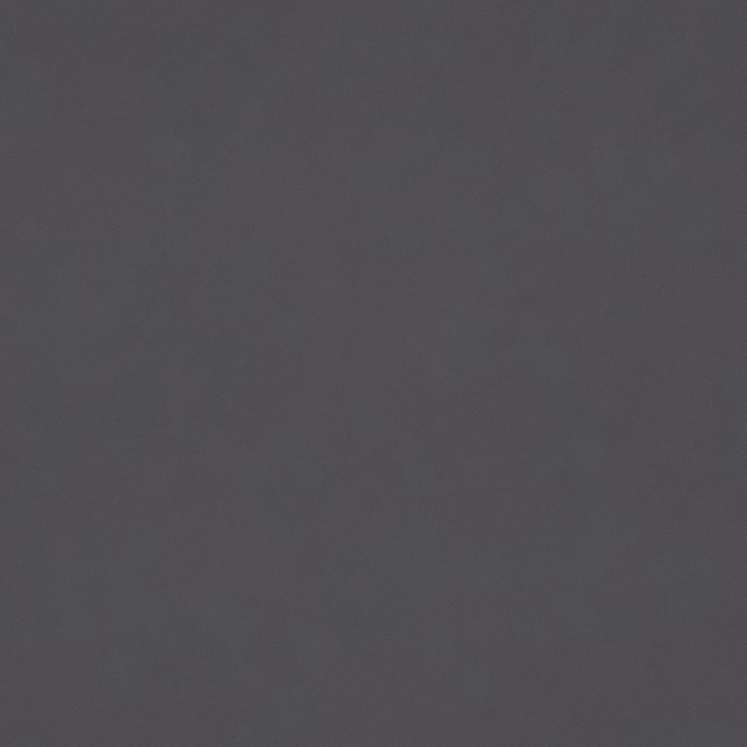 Close-up of plain charcoal-grey velvet with a softly shifting nap