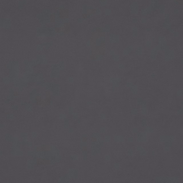 Close-up of plain charcoal-grey velvet with a softly shifting nap